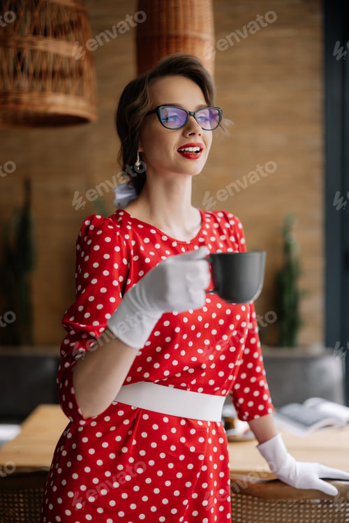 Preview: Elegant woman enjoying coffee in retro style dress