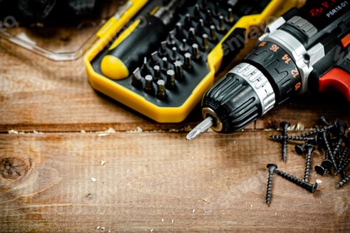 Preview: Working tools. Screwdriver bits. On a wooden background.