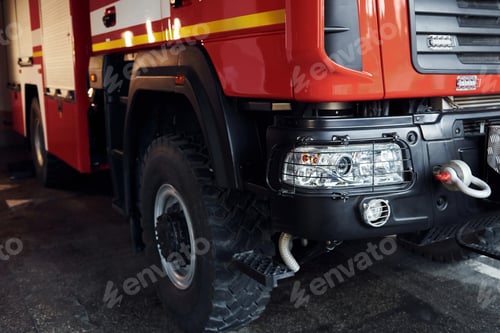 Preview: Close up view of front part of red fire truck. Natural lighting