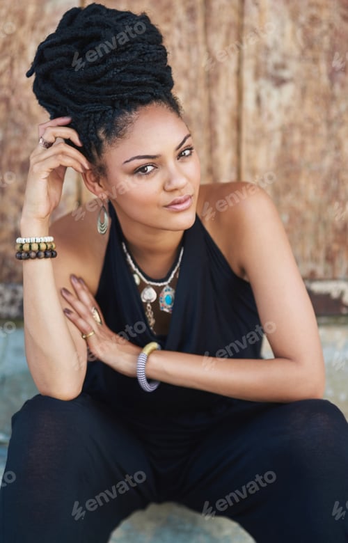 Preview: Her beauty comes from her confidence. Portrait of an attractive young woman posing outdoors.