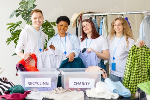 Preview: young people are engaged in charity and volunteering, selecting clothes for recycling and charity