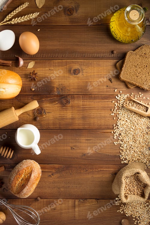 Preview: wheat grains and bakery ingredients on wood