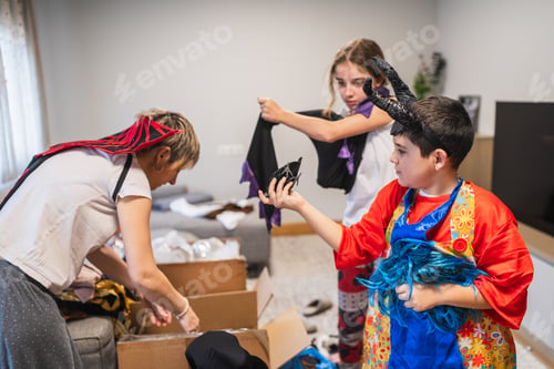Preview: Children and mother trying on carnival costumes for celebration