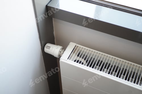 Preview: heating radiator under window in the room