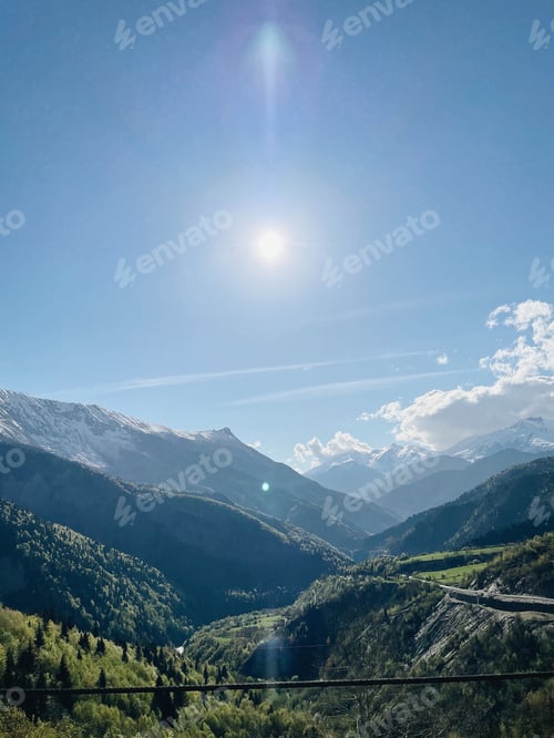 Preview: Sunny weather in green mountains with snowy picks. Scenery view of mountains in Georgia. Serpentine