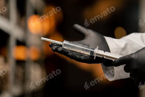 Preview: mushroom farm mycologist in gloves holding syringe with mushroom seeds growing natural products