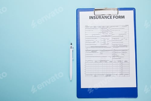 Preview: top view of insurance form on clipboard and pen isolated on blue