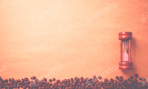 Preview: Coffee Beans And Hourglass On Brown Craft Paper Background