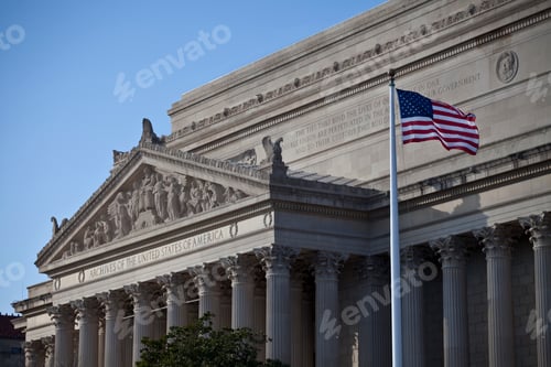 Preview: Flag waving in front of a National archives building, Washington, D.C.