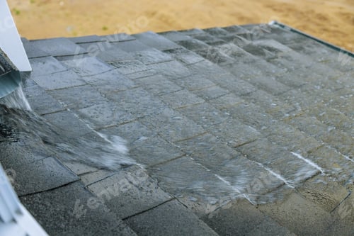 Preview: Water flows on the roof during a heavy downpour