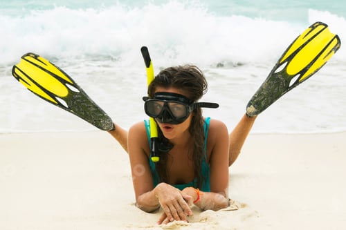 Preview: Beautiful young woman after snorkeling on the beach