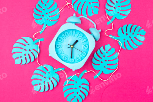 Preview: Tropical leaves with alarm clock