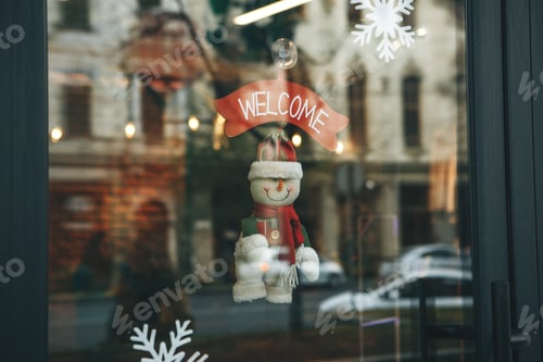 Preview: Christmas decoration of the door in the cafe with the inscription 'Welcome''