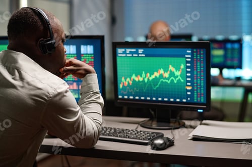 Preview: Unrecognizable Man Working with Stock Trading Data