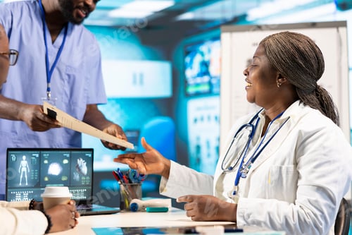 Preview: Health specialist advising a young patient during a clinic checkup visit
