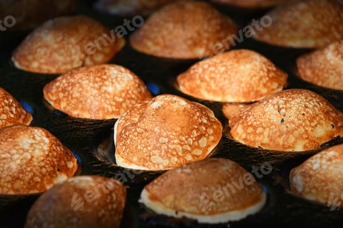 Preview: Close up cooking small Dutch traditional pancakes