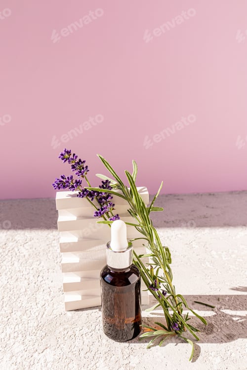 Preview: Beautiful still life of a cosmetic bottle with a white dropper, live lavender and a plaster podium
