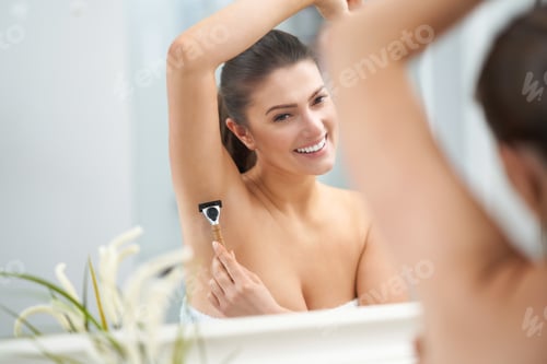Preview: Young nice brunette woman in the bathroom