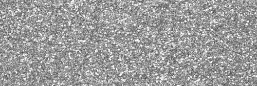 Preview: Silver decorative sequins. Background image with shiny bokeh lights from small elements