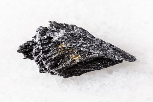 Preview: sample of raw black kyanite mineral on white
