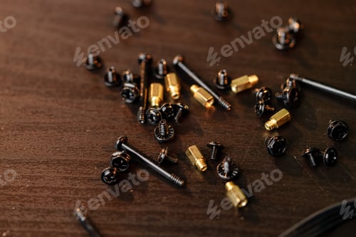 Preview: Screws for the computer case on wooden background