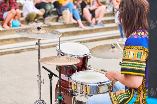 Preview: Drummer man playing drums percussion with drum sticks, drum set on concert stage, sticks and drums