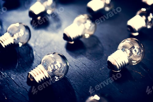 Preview: Lightbulbs on black textured table