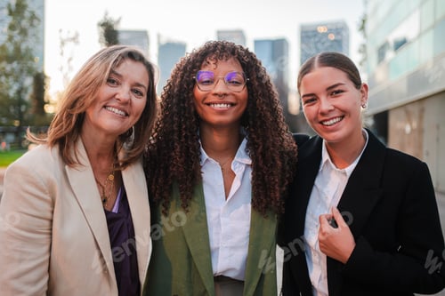 Preview: Three confident businesswomen smiling looking at camera. Teamwork, diversity, professionalism, and
