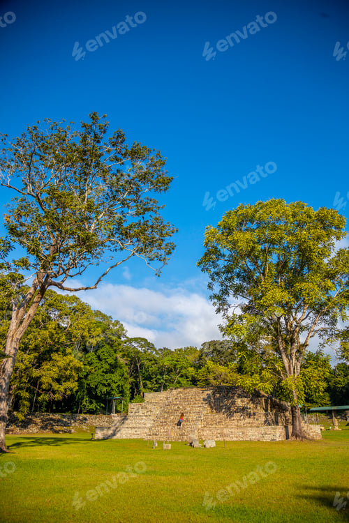 Preview: A young girl climbing a pyramid in The Copan Ruins temples. Honduras