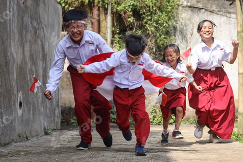 Preview: Group of students running and hoisting Indonesian flag