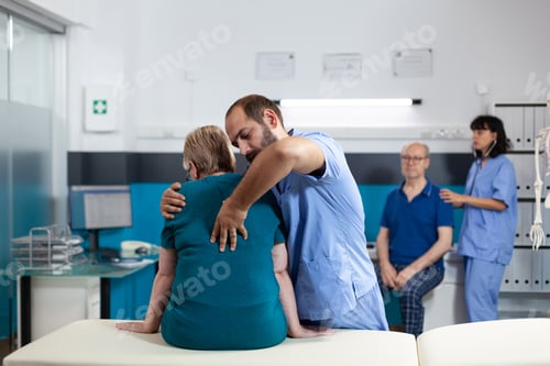 Preview: Medical assistant treating woman with back and spine pain