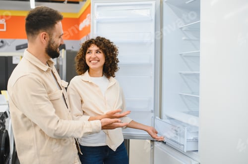 Preview: Couple exploring refrigerators in electronics store