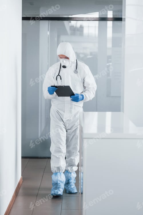 Preview: Healthcare Worker Reviews Notes in a Modern Hospital