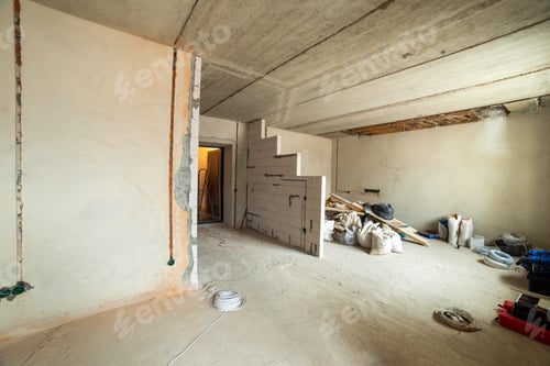 Preview: Unfinished Room with Exposed Concrete and Construction Materials