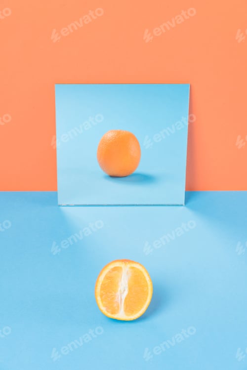 Preview: Orange on blue table isolated over orange background