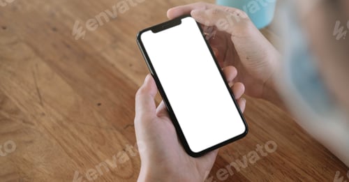 Preview: Top view Woman sitting and holding blank screen mock up mobile phone