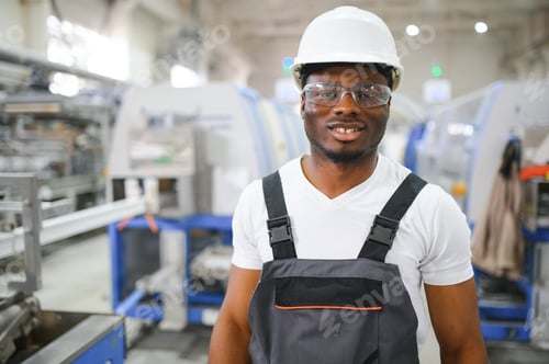 Preview: An African-American male worker in a plastic window frame factory