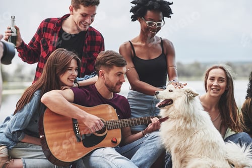 Preview: Group of people have picnic on the beach. Having fun at weekend time