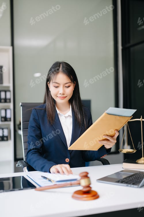 Preview: Asian woman lawyer working and gavel, tablet, laptop in front, Advice justice and law concept.