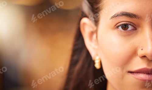 Preview: Close up portrait of a beautiful young womans face with smooth flawless skin. Indian female showing
