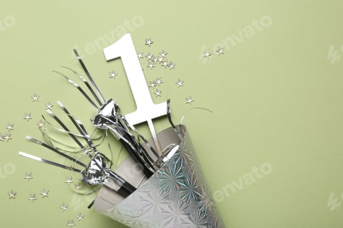 Preview: Party hat, blowers, topper and confetti on light green background, top view. Space for text