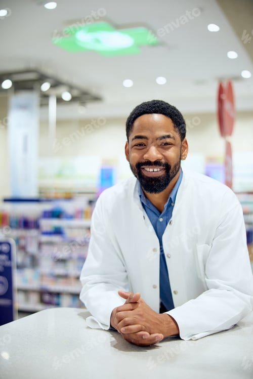 Preview: Friendly Pharmacist Smiling in a Modern Drugstore Interior With Shelves Visible