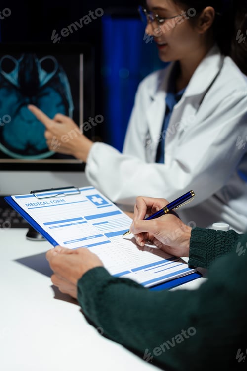 Preview: Doctor and an patient are talking and consulting at the table in the clinic.