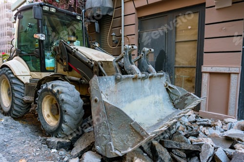 Preview: The tractor removing concrete debris and paving slabs