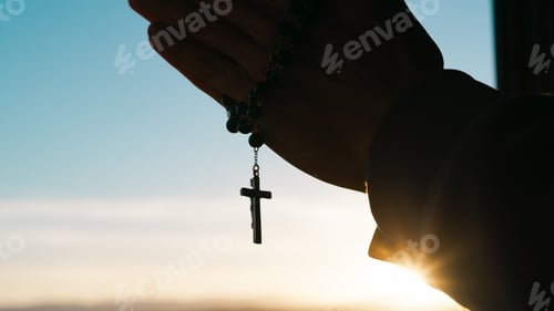 Preview: Silhouette of praying hands with christian crucifix