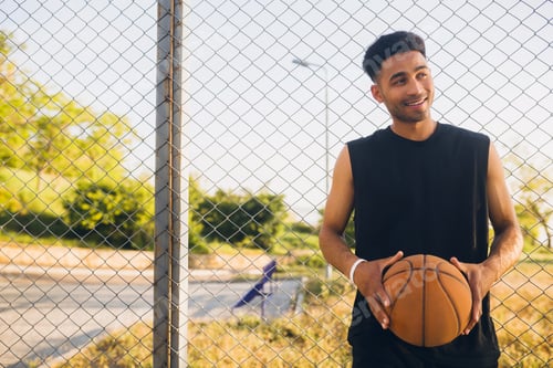 Preview: black man doing sports, playing basketball on sunrise, active lifestyle, sunny summer morning