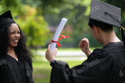 Preview: graduates in caps and gowns beam with joy, embracing and cheering in celebration.