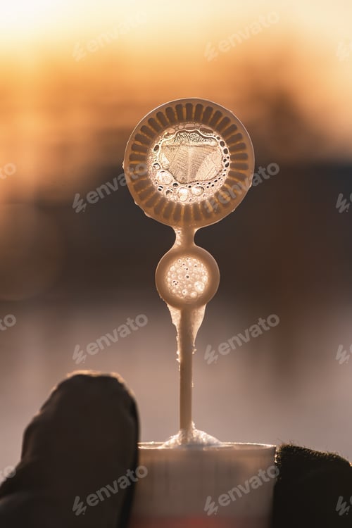 Preview: soap bubble stick with beautiful frost patterns in winter outdoors