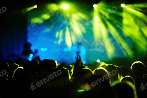 Crowd Enjoys Concert Performance with Bright Green Lights