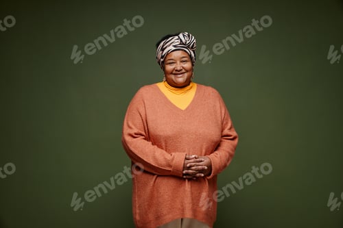 Preview: Black Senior Woman Wearing Colorful Clothes on Green